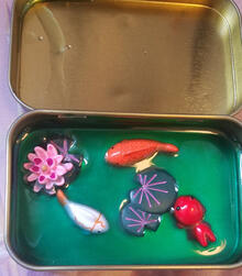 Fish pond in an Altoid tin
